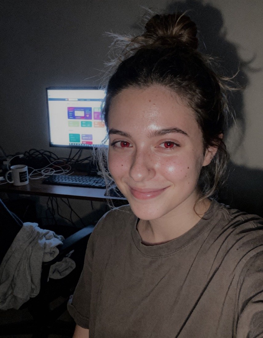 Student with the automation dashboard she built running behind her